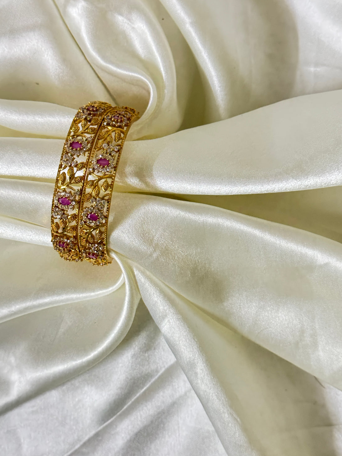 Radiant Elegance: Golden Bangles with Red Stones and Floral Design(size 2.6)