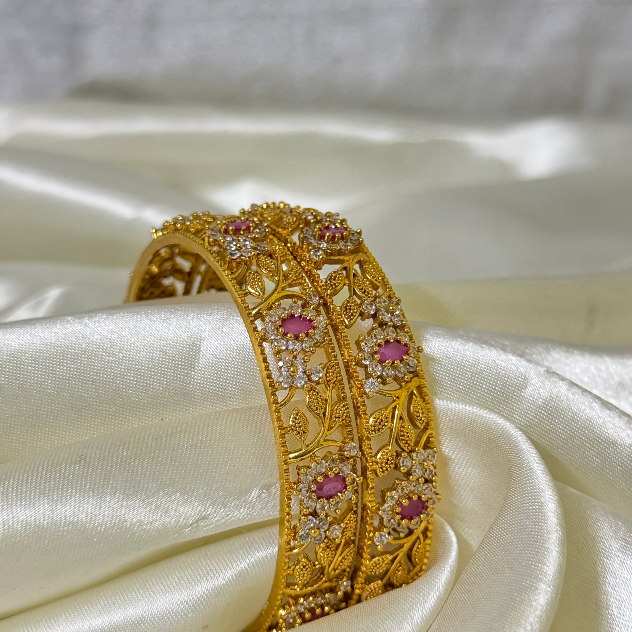 Radiant Elegance: Golden Bangles with Red Stones and Floral Design(size 2.6)