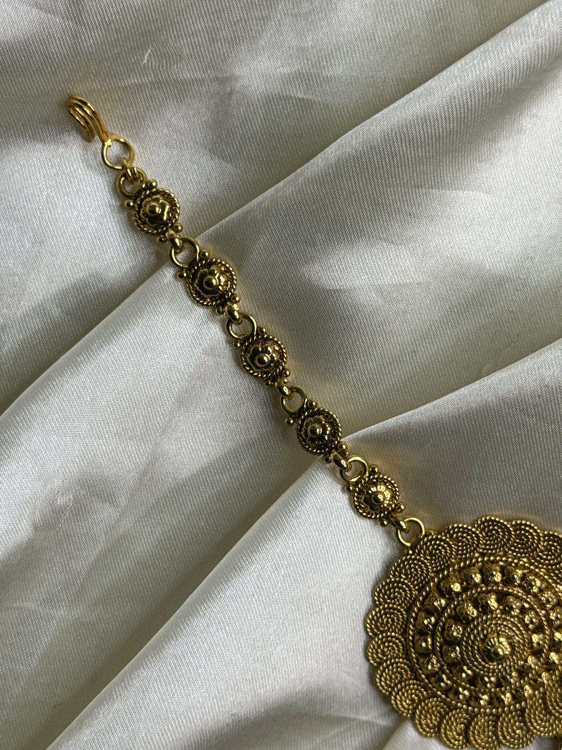 Golden Heritage: Antique Maangtikka with Unique Pattern and Golden Beads