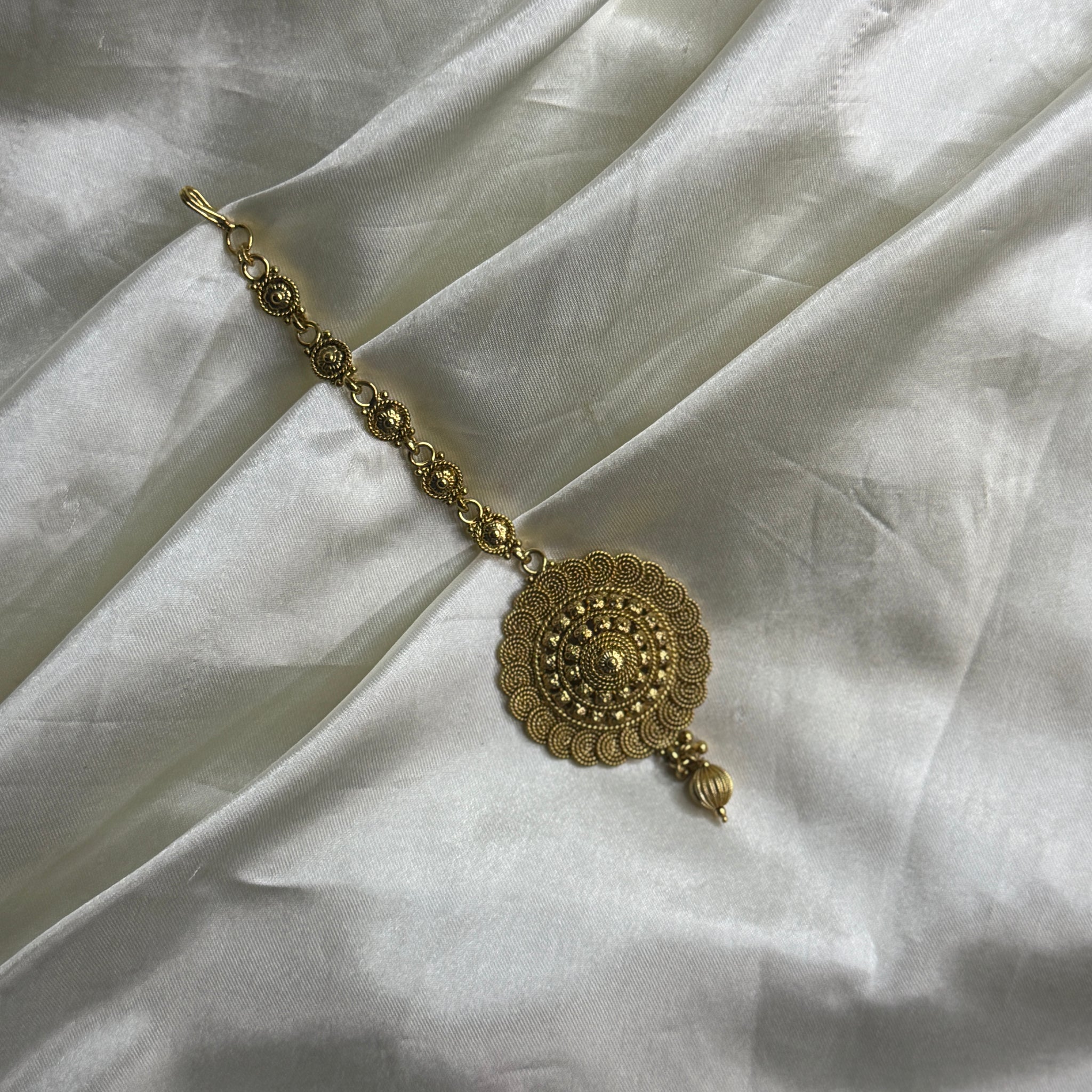 Golden Heritage: Antique Maangtikka with Unique Pattern and Golden Beads