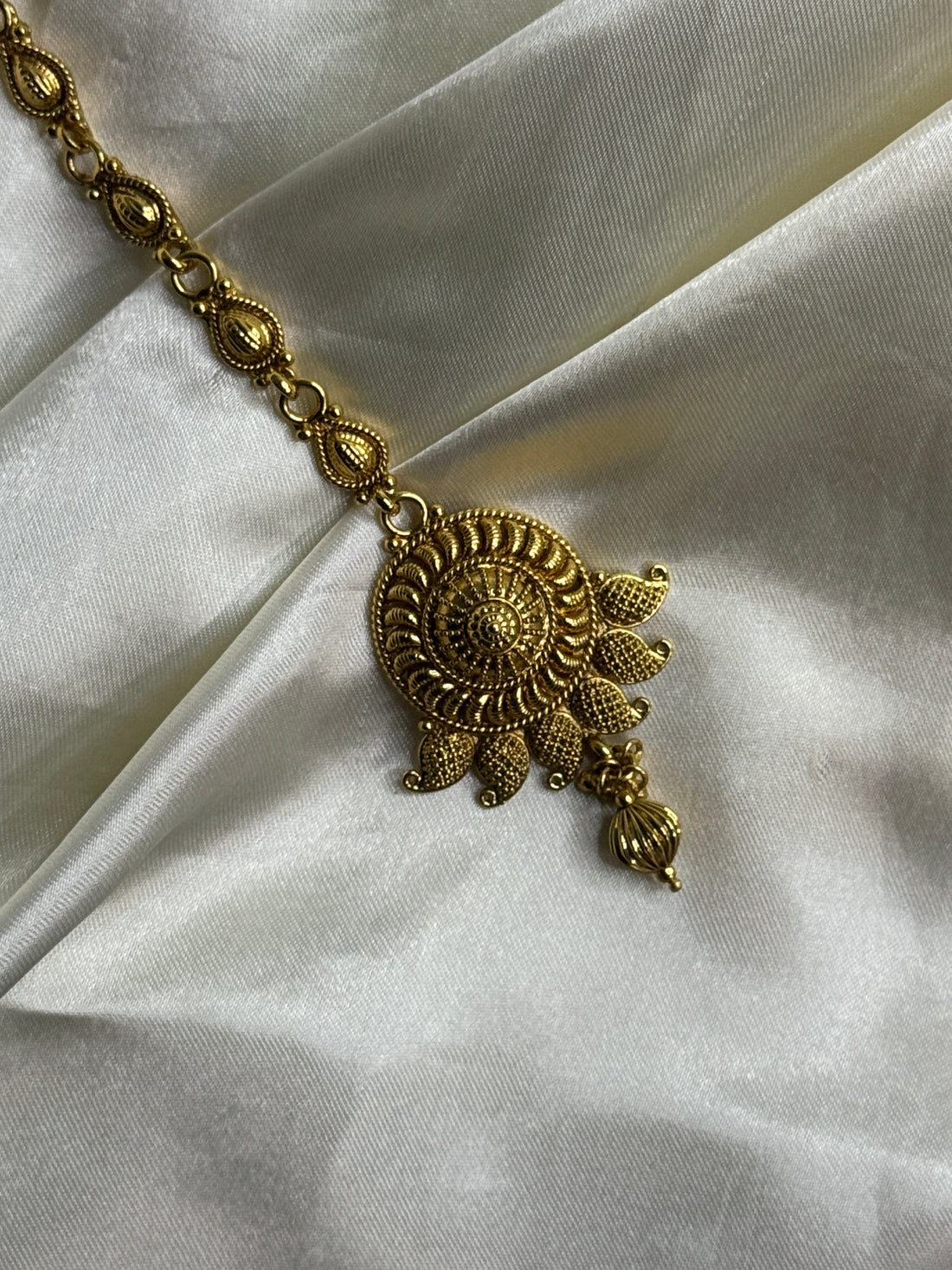 Golden Bloom: Antique Maangtikka with Leaf Motif and Golden Beads