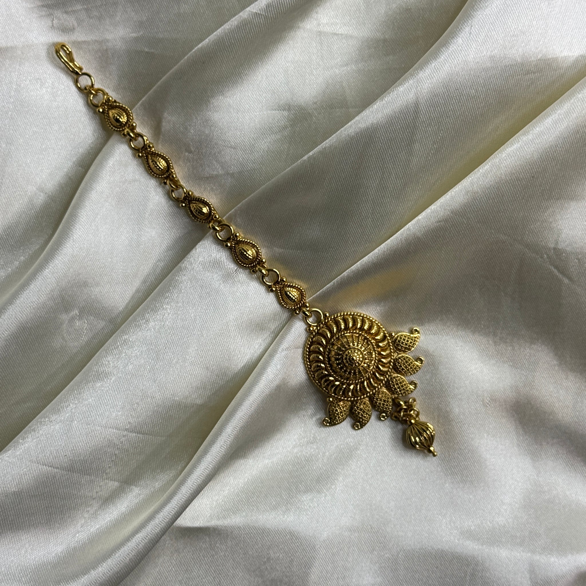 Golden Bloom: Antique Maangtikka with Leaf Motif and Golden Beads