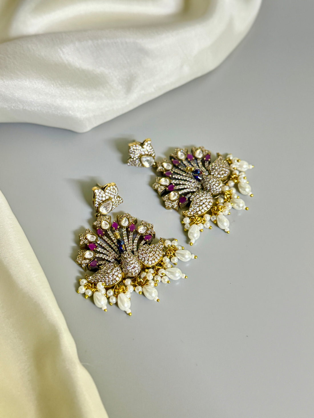 Colorful Peacock Design AD Earrings with White Beads & Stone Accents" - Jewels by Meena