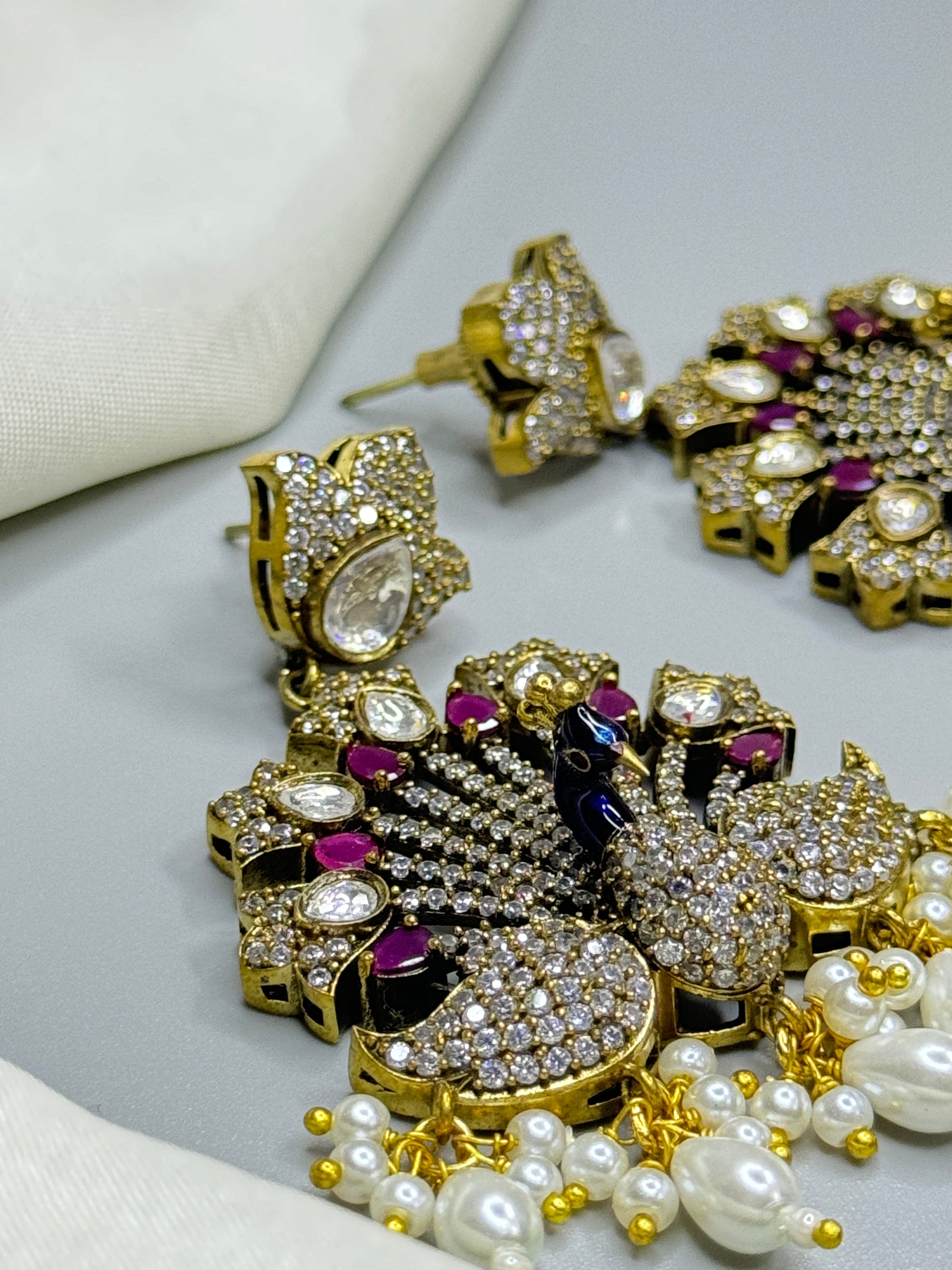 Colorful Peacock Design AD Earrings with White Beads & Stone Accents" - Jewels by Meena