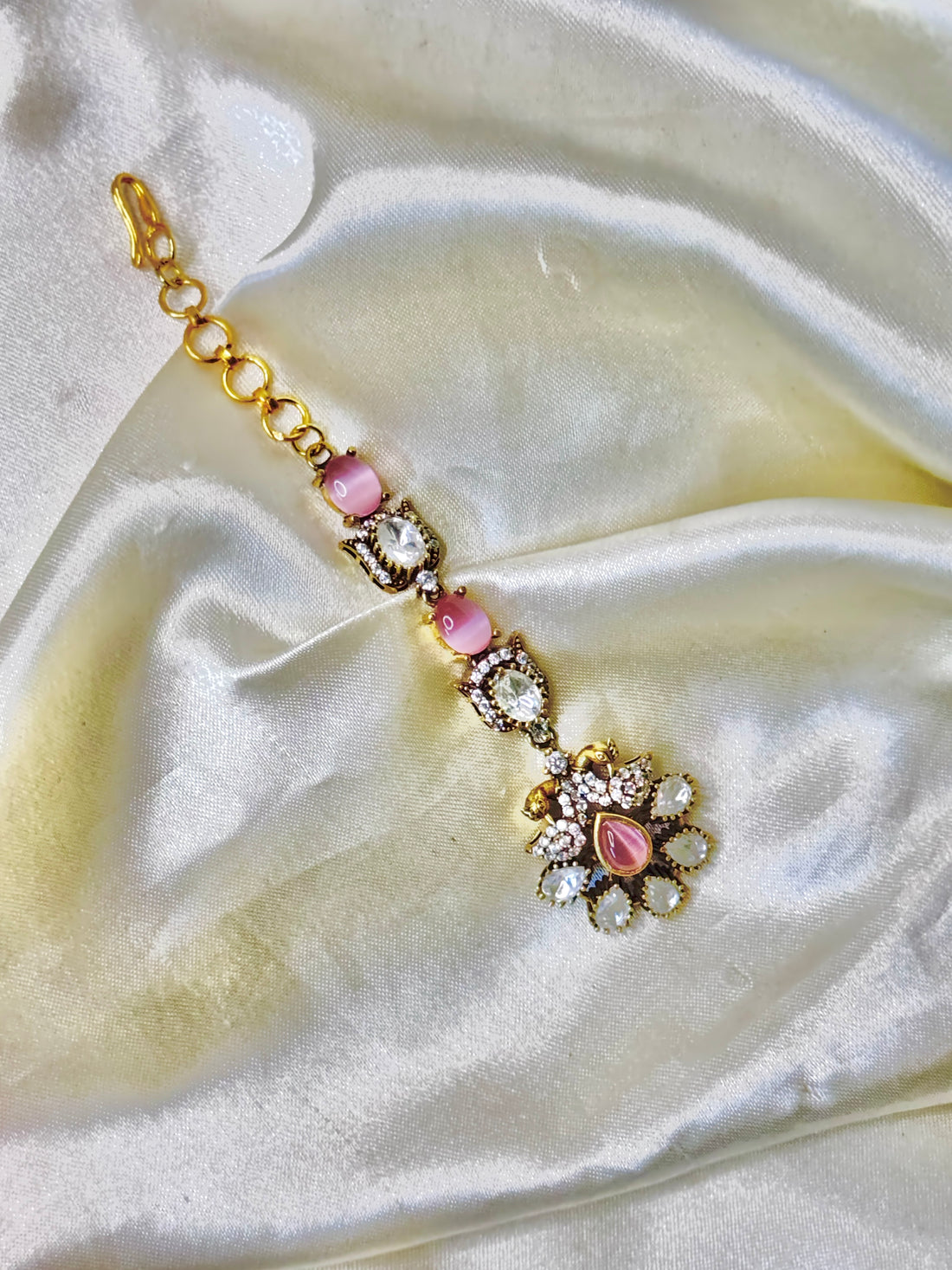 Peacock-Inspired Pink Stone Maangtikka with Floral Accents
