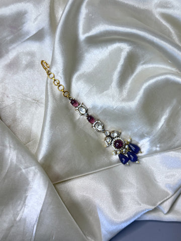 Enchanting Purple Stone Maangtikka with Floral & Leaf Accents