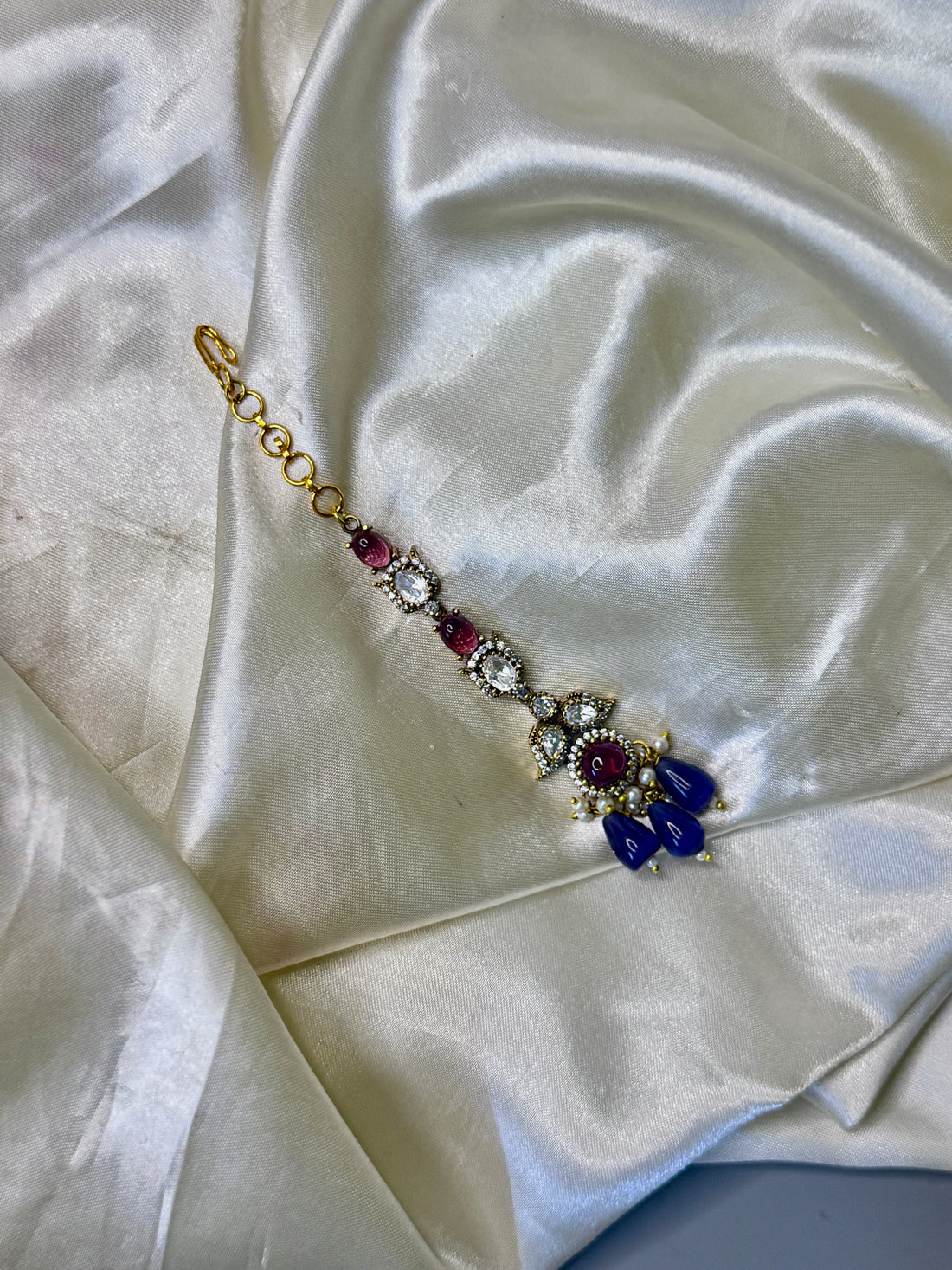 Enchanting Purple Stone Maangtikka with Floral & Leaf Accents