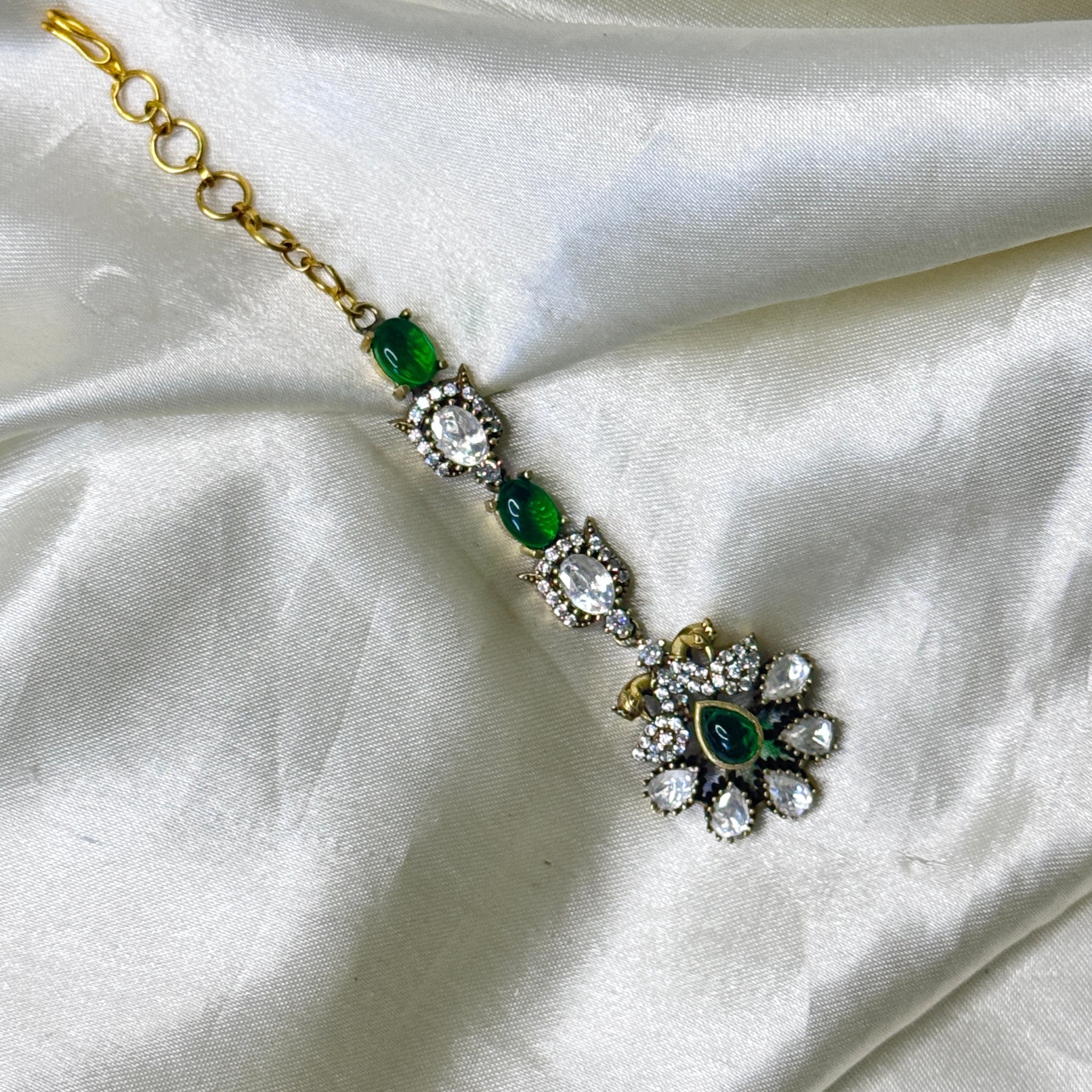 Graceful Peacock Maangtikka with Green Stones & Floral Accents