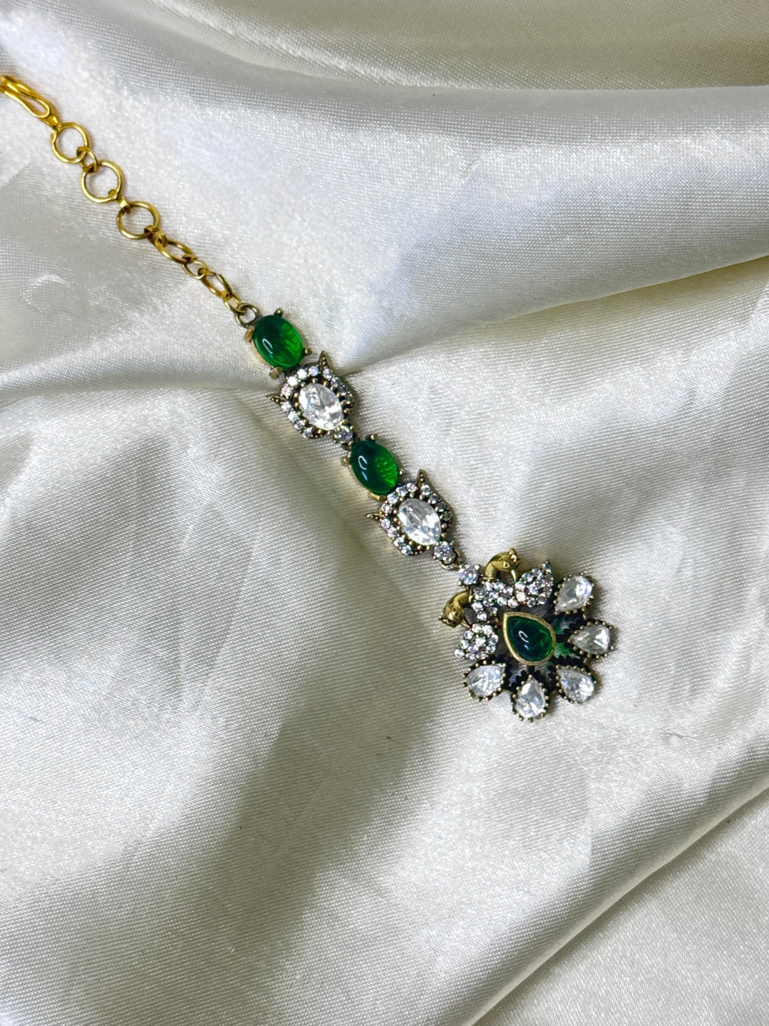Graceful Peacock Maangtikka with Green Stones & Floral Accents