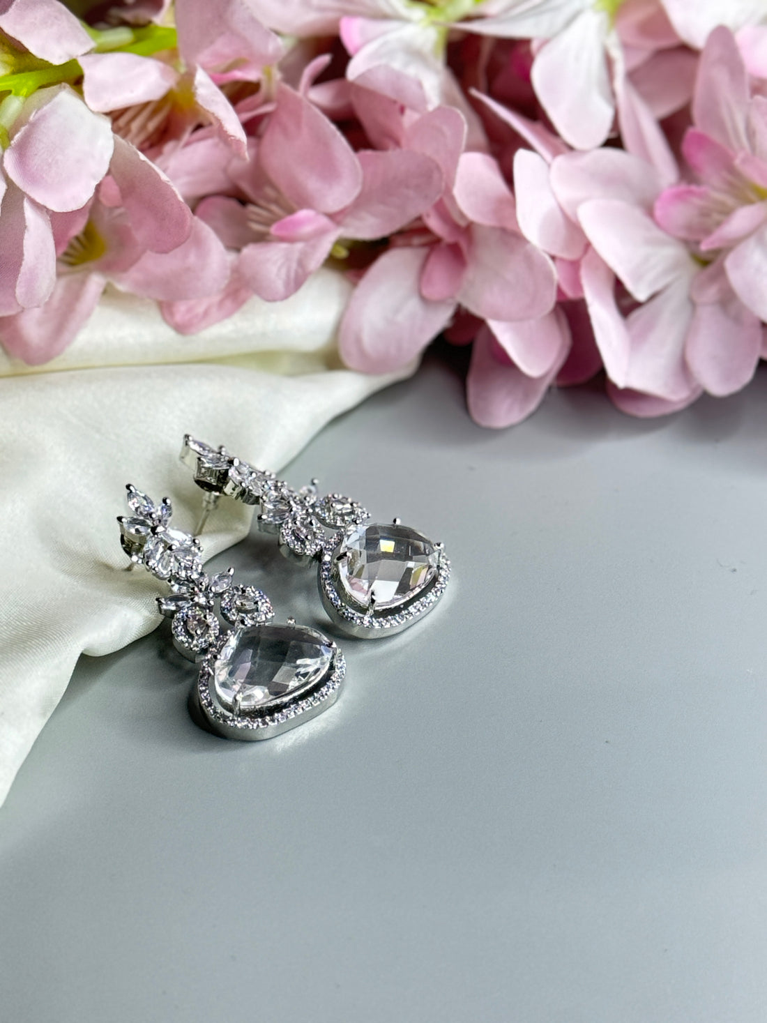 "Elegant AD Earrings with Dazzling Crystal Stones"