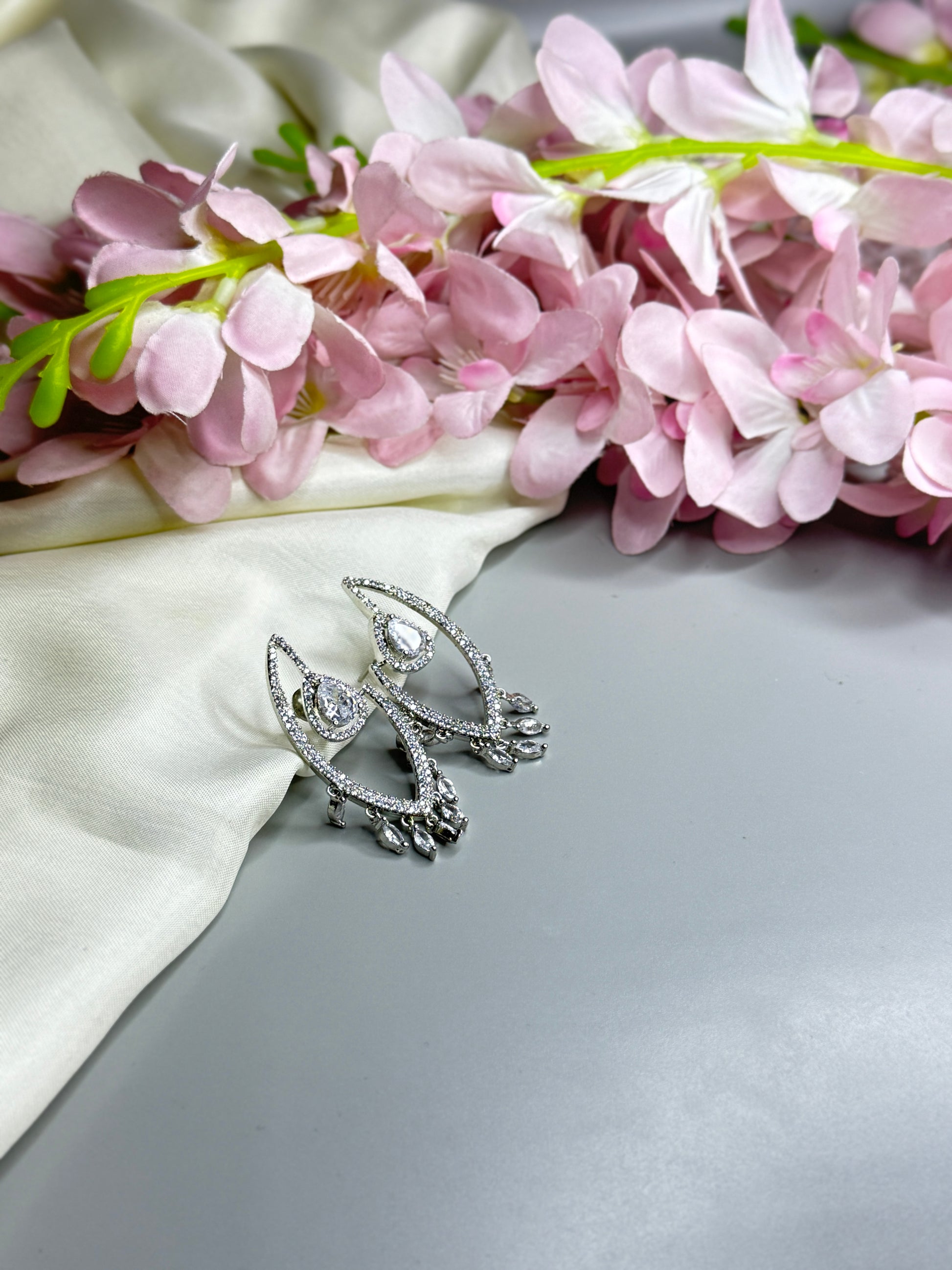 Chic AD Earrings with Radiant Crystal Accents" - Jewels by Meena