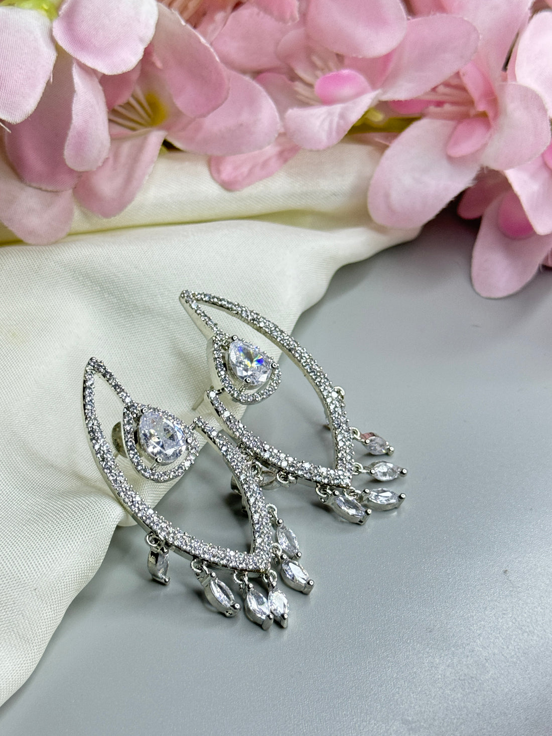 Chic AD Earrings with Radiant Crystal Accents" - Jewels by Meena