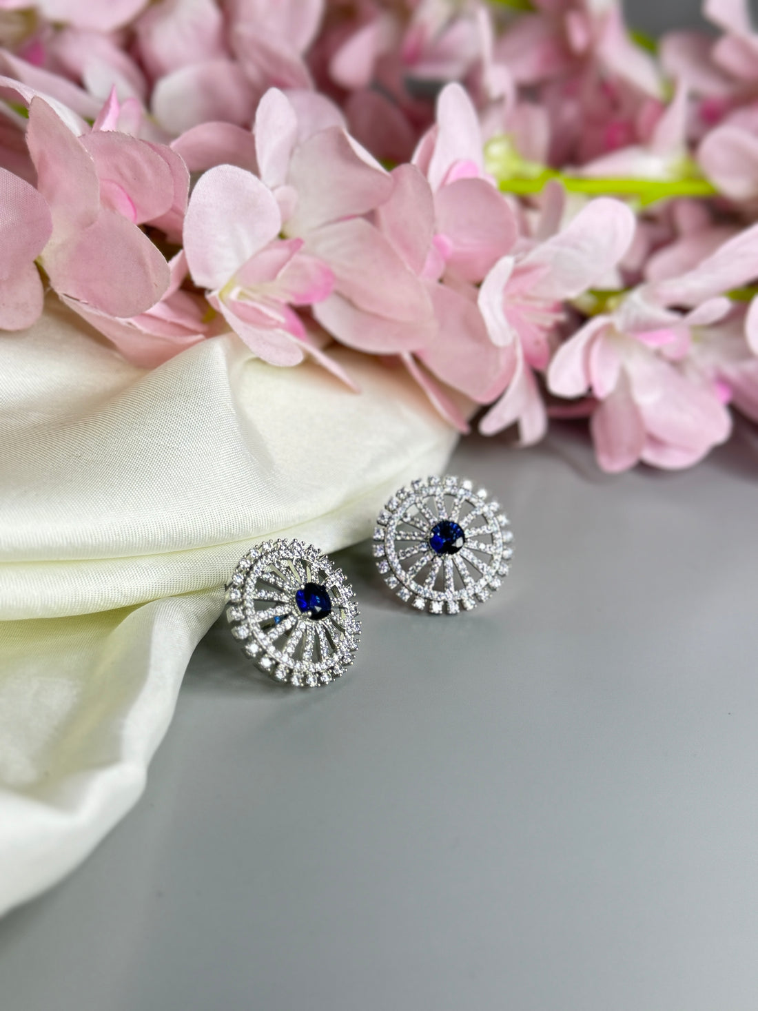 "Elegant Blue Stone Earrings with Sparkling Diamond Finish"