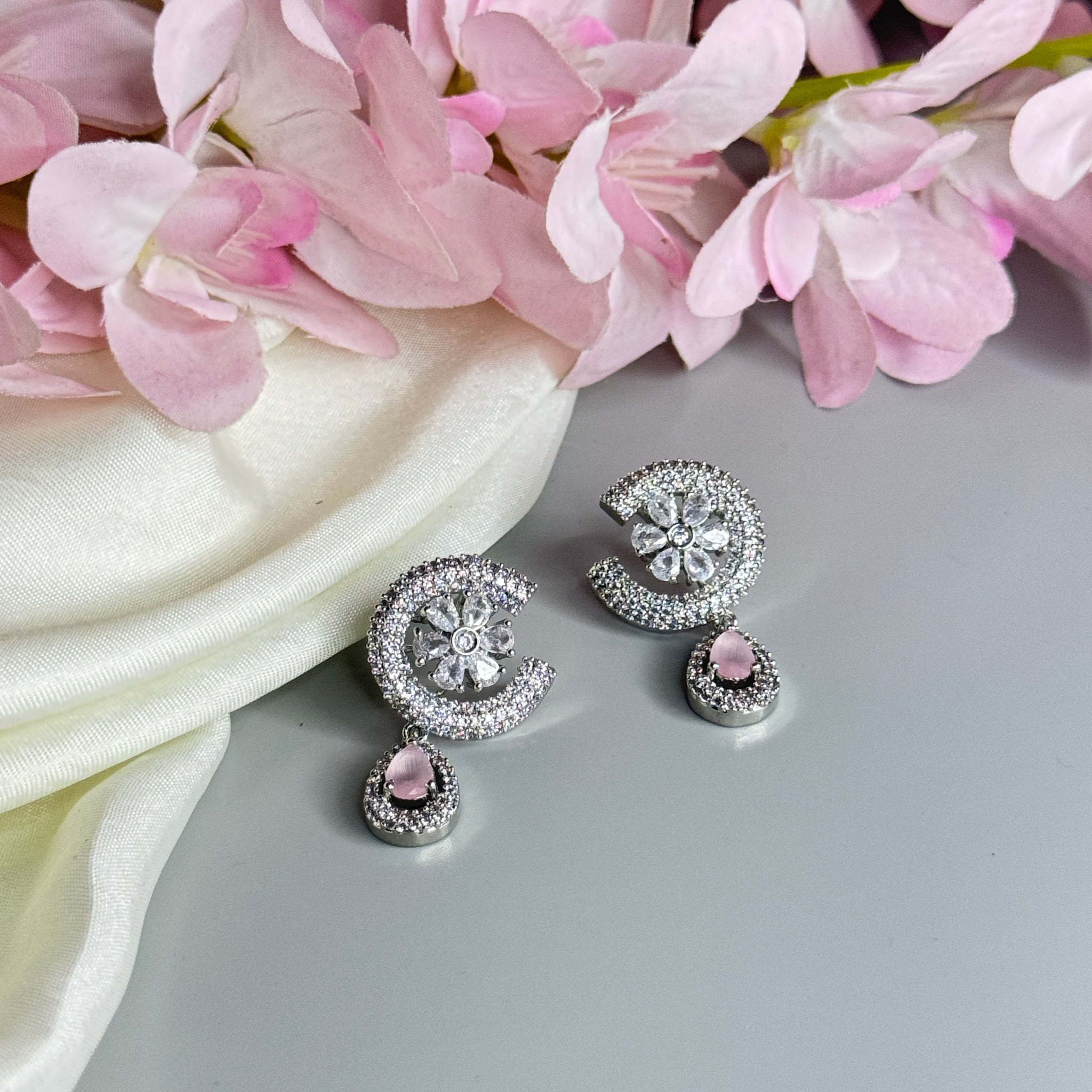 "Charming Floral Earrings with Pink Stone and Crystal Accents"