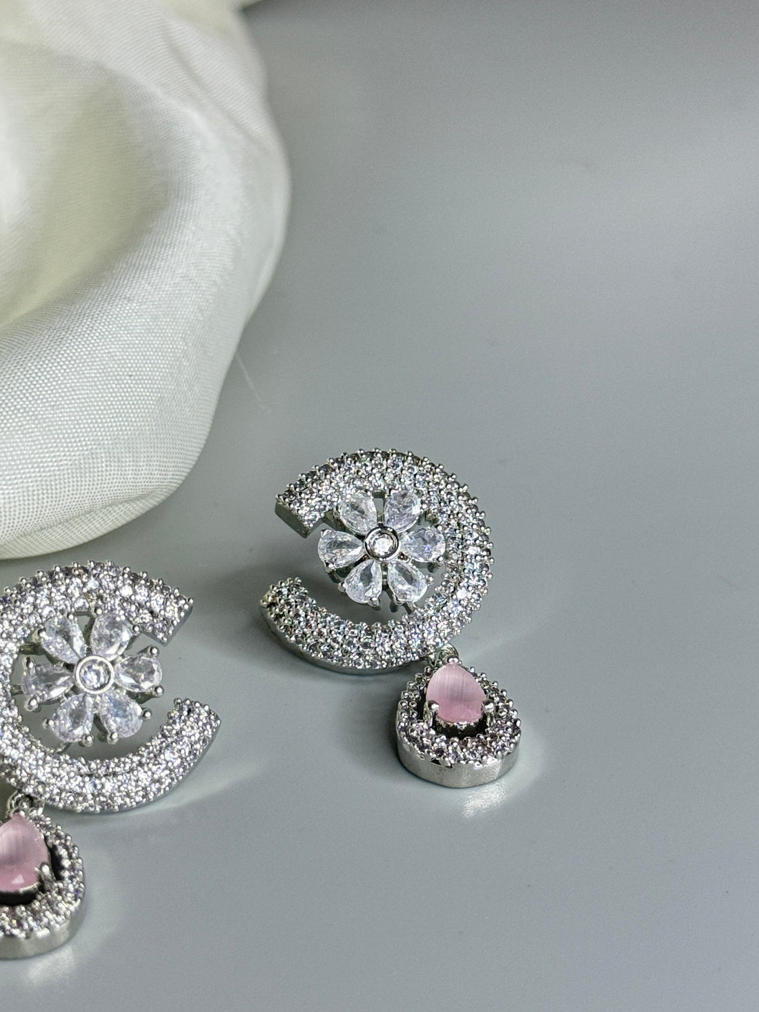 "Charming Floral Earrings with Pink Stone and Crystal Accents"