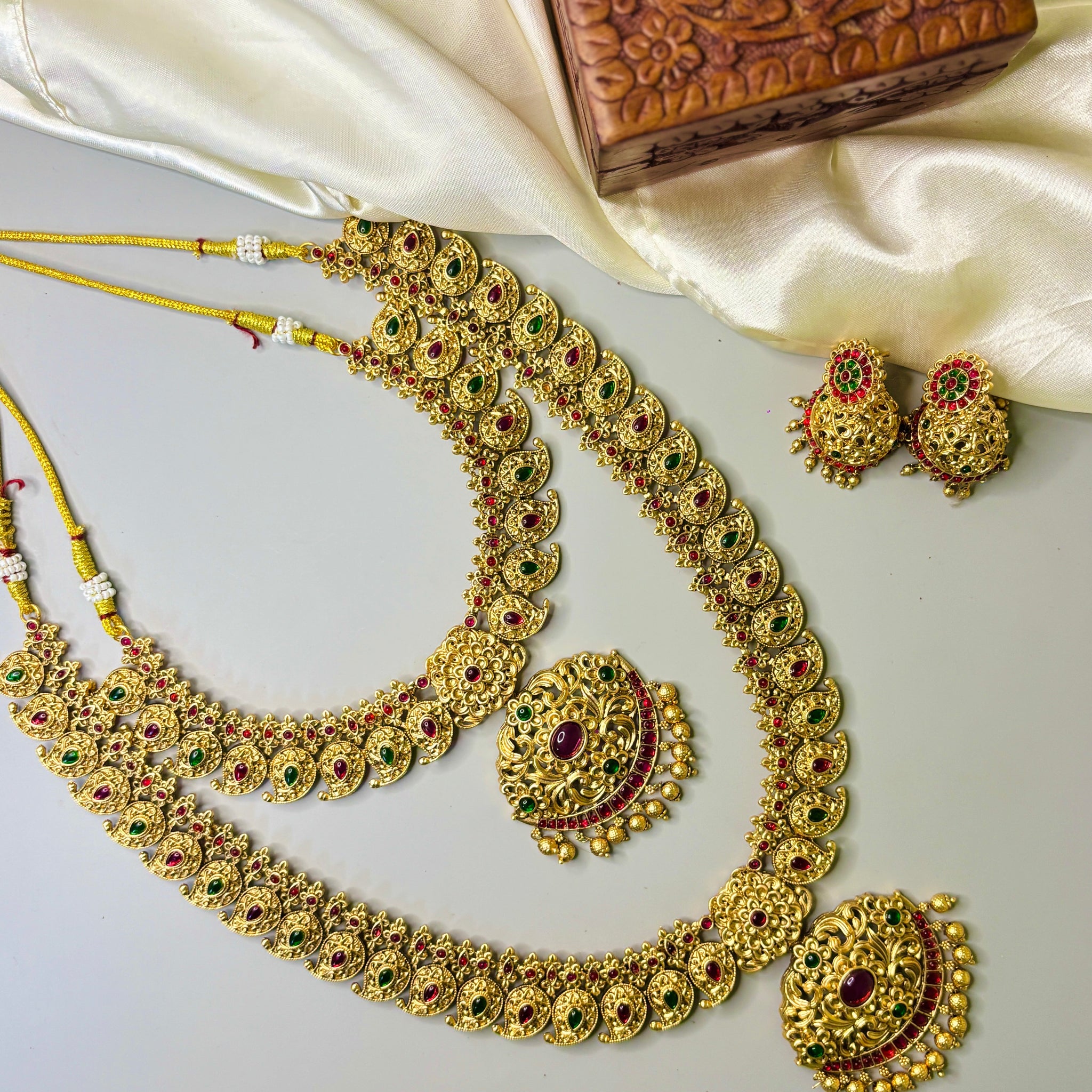 Traditional Floral & Leaf Motif Necklace Set with Red-Green Stones & Golden Beads