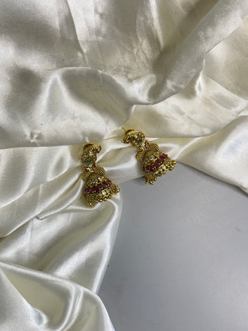 Majestic Jumka Earrings with Peacock Detailing, Red Stones & Crystal Finish
